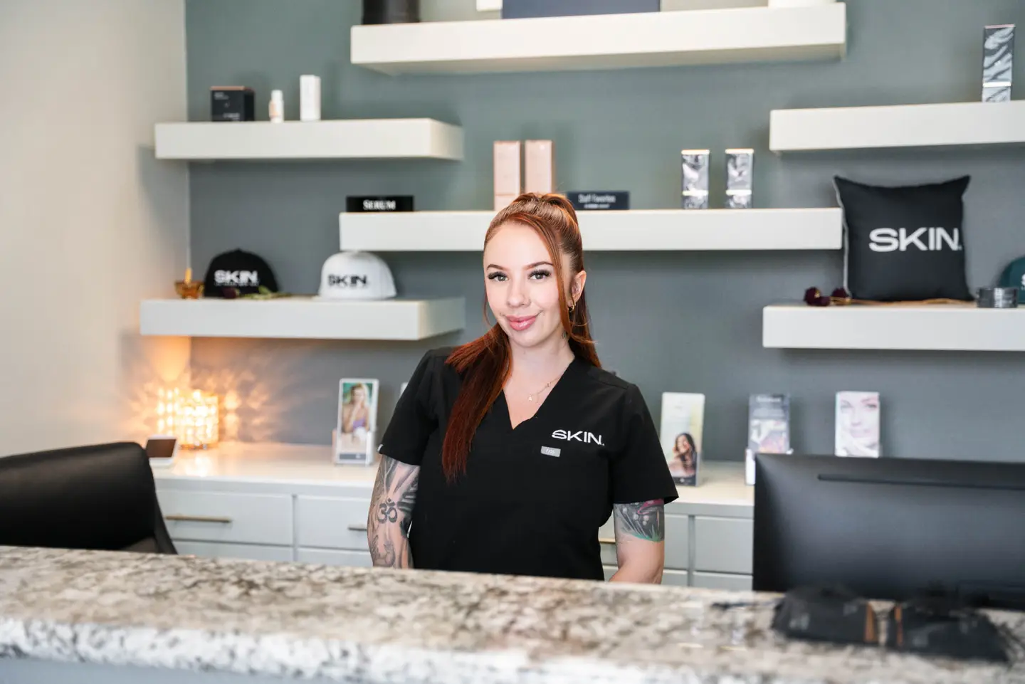 Front desk team member welcoming clients at SKIN Las Vegas med spa